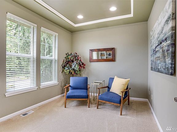 Perfectly placed right off the formal entrance you will find this private den with coffered ceiling. Usher your work associates right in while keeping your private home spaces personal. Notice the large picture windows that allow in the natural light.  The perfect perch from which to watch the world go by!