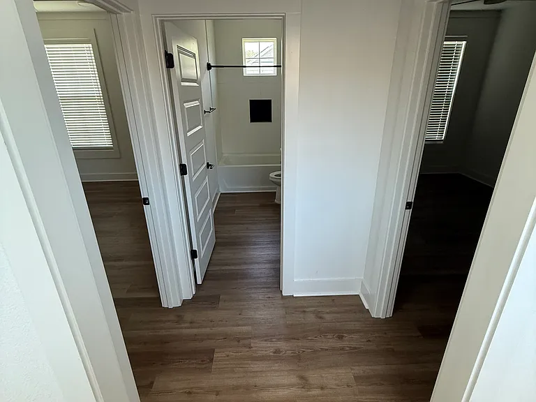 Bedroom 2 and 3 with bathroom in the middle