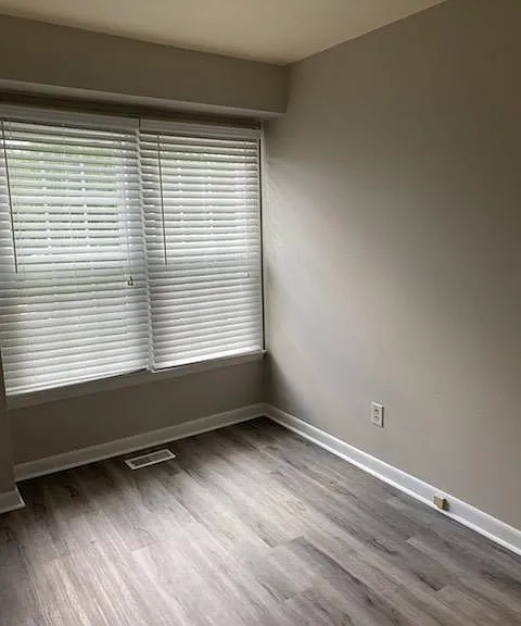 Second bedroom; vinyl flooring.