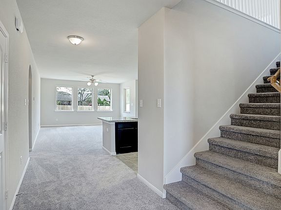 Stairs tucked off gallery