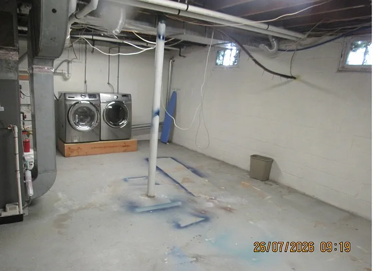 basement w washer and dryer heater hot water heater and dehumififier