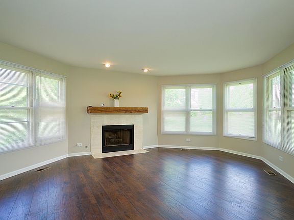 Living room with gas fireplace and panoramic windows