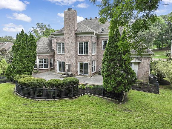 Aerial view of back Patio. Great area for entertaining. Picnic Table, Umbrella & Gas Grill do not remain.