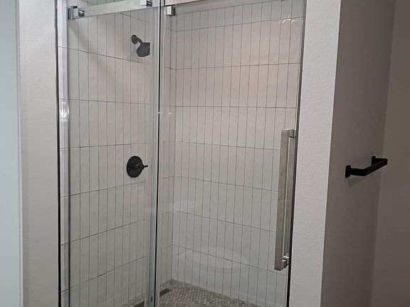 primary bathroom steam shower - marble flooring
