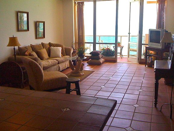 living room with direct ocean view, terracotta tiling with inlays throughout