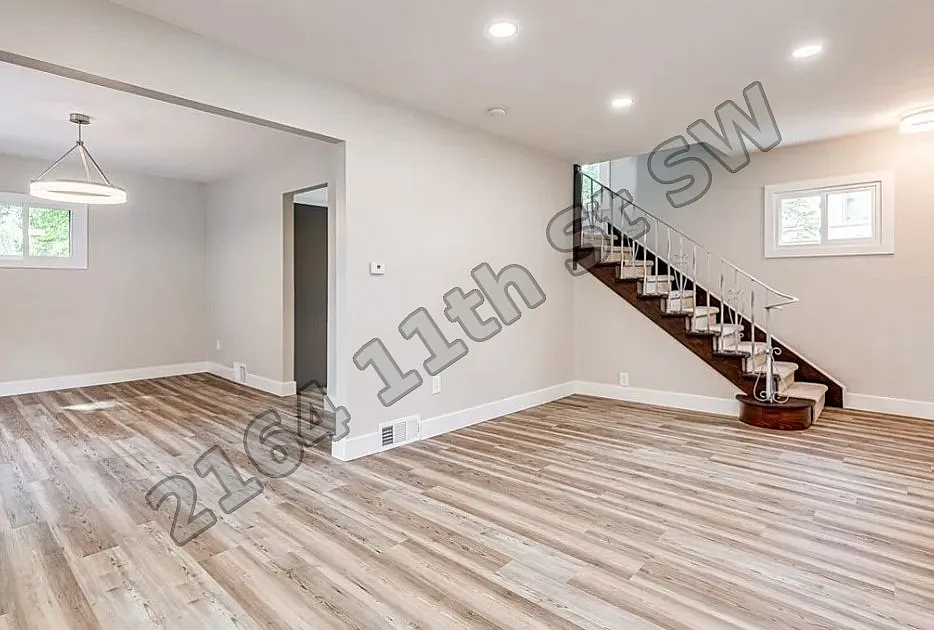 Living room with stairs - 2164 11th St SW