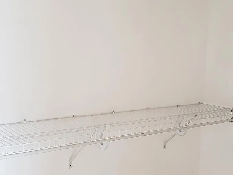 Walk-in master bedroom closet.