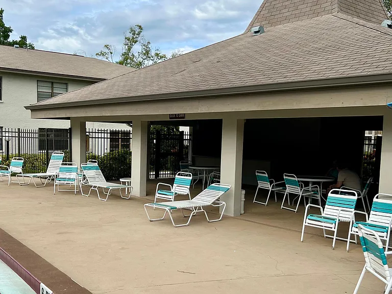 Pool clubhouse with restrooms. Refrigerator available to use for outdoor dining while at pool.
