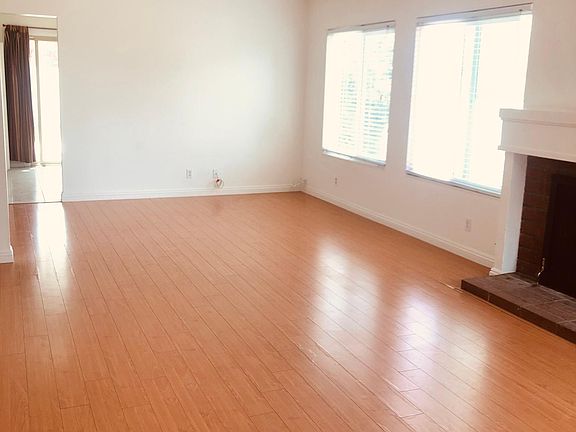 Living Room, access to kitchen straight ahead; access to bedrooms to the left.