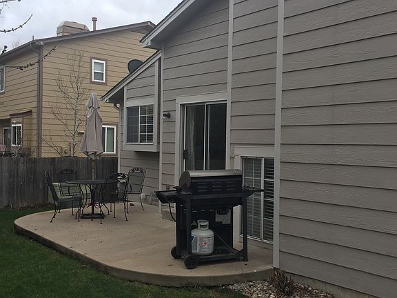 Fenced backyard with patio