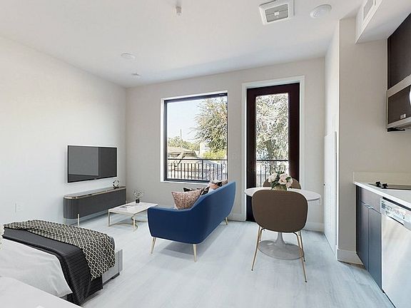 Open-Concept Studio with Natural Light and Patio Access