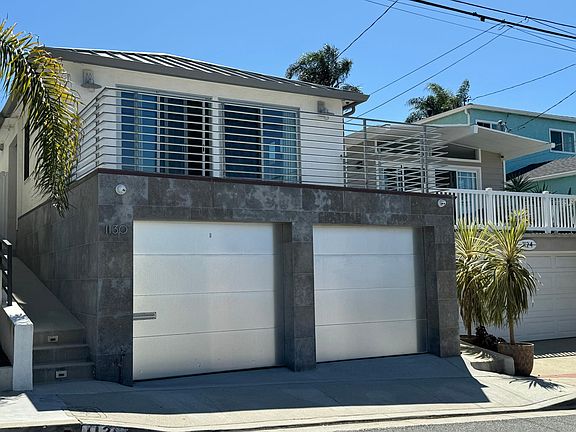 Two car garage, epoxy floor, with storage racks and storage area. You can park in front of garage too if needed