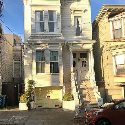 View of the Victorian building. Flat is on the middle level above the garage. 2-bedroom 2-bath 1400 square foot with all hardwood floors and new double pane energy efficient windows throughout.