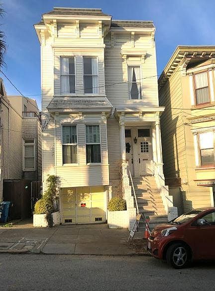 View of the Victorian building. Flat is on the middle level above the garage. 2-bedroom 2-bath 1400 square foot with all hardwood floors and new double pane energy efficient windows throughout.