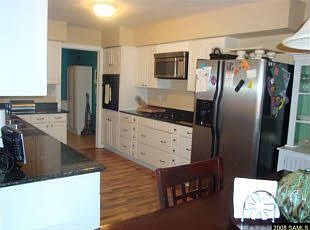 Granite countertops and laminate wood floors