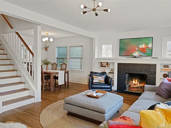 Open living space w/ wood burning fireplace