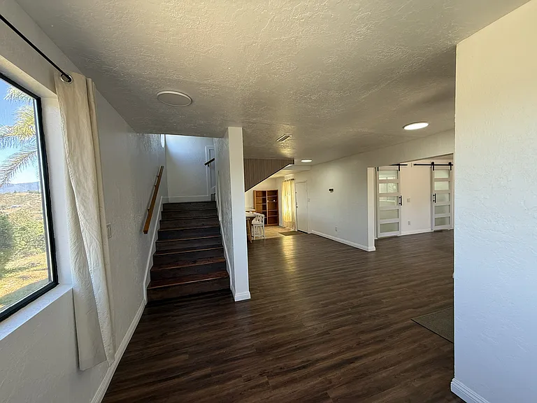 Stairway, Foyer, Dining, Kitchen, & Living Room