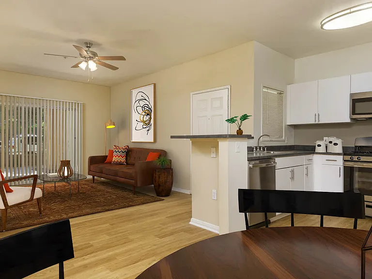 Living Room with Patio and Kitchen with Stainless Steel Appliances