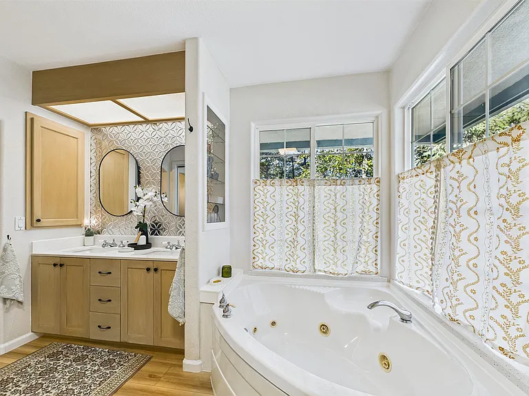 +Attached to primary bedroom
+Double sinks
+Jetted tub + stand-up shower