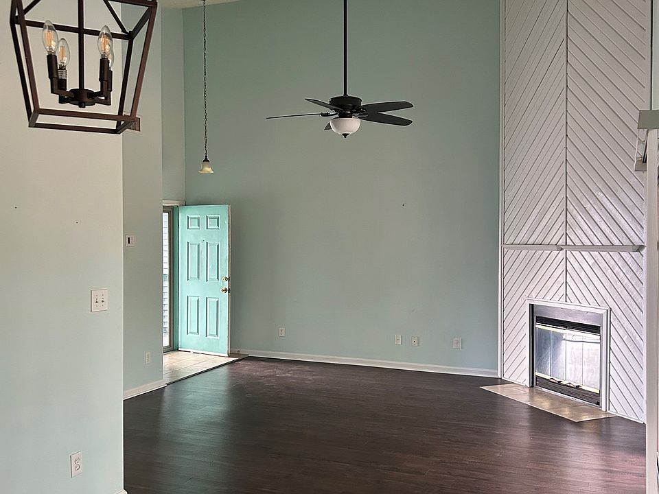 Open living space with high ceilings and plenty of natural light