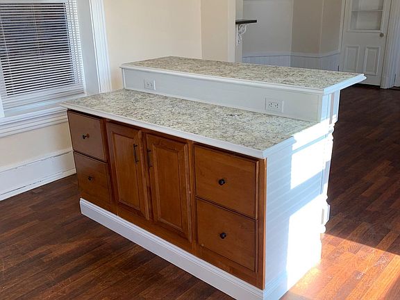beautiful custom built island with tons of storage , counter space, and electric outlets