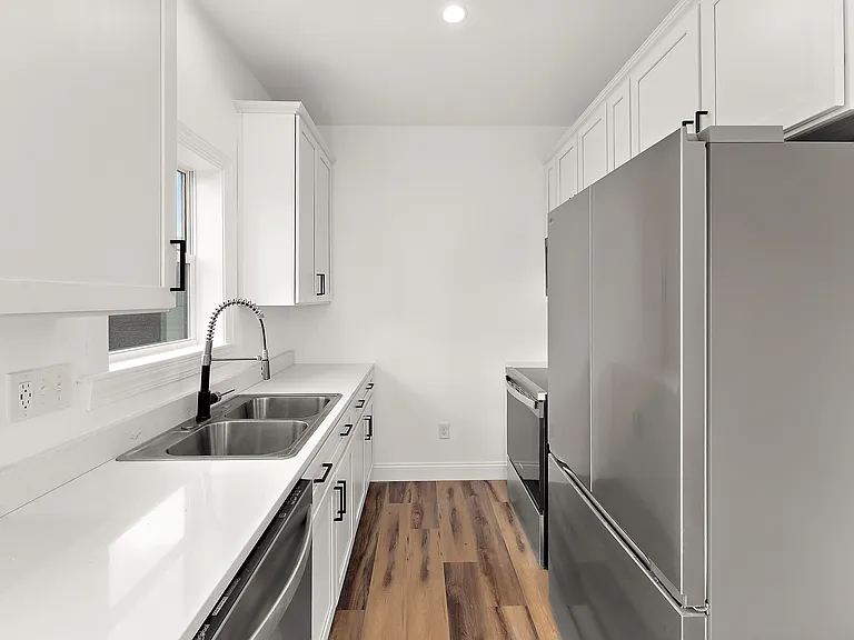 Kitchen with Quartz Countertops and Stainless Steel Appliances