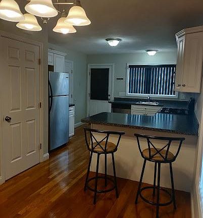 First Floor-Kitchen, good storage space and fully applianced with stainless steel refrigerator, dishwasher, microwave, gas stove and oven, garbage disposal and Lazy Susan's cabinet