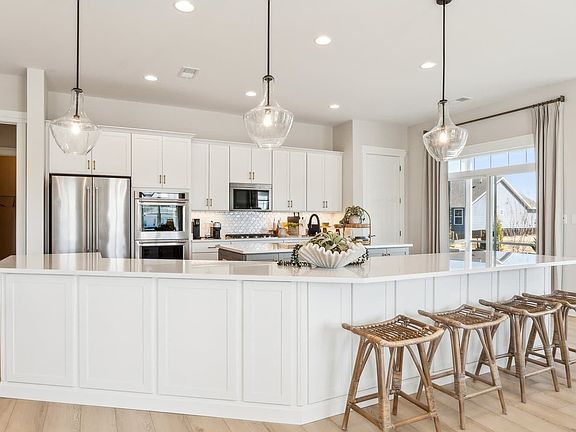 The kitchen of the Quincy II at Heritage Shores by Brookfield Residential.