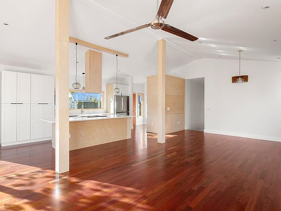 Open floor plan, living area. Entrance, powder room (1/2 bath), living room, dining room and kitchen.