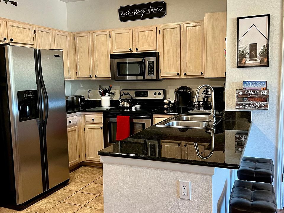 View of kitchen from dining room. Walk-in pantry is to the right.