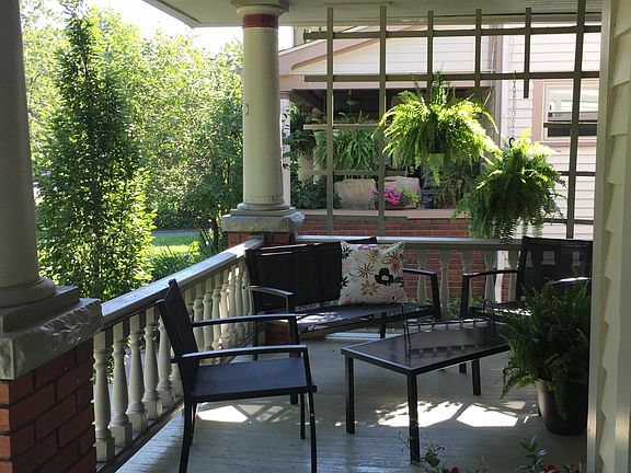 Classic front porch -- furniture included