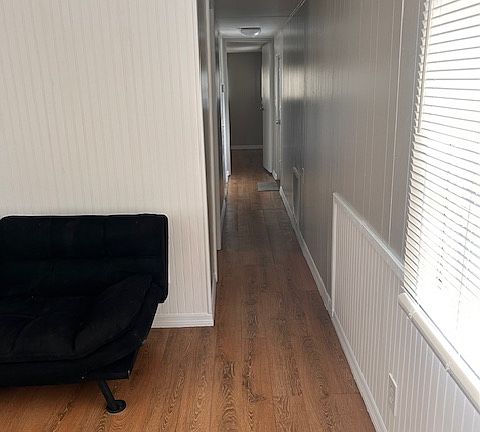 Hallway to bedrooms and bathroom - back door to laundry