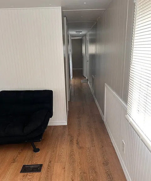 Hallway to bedrooms and bathroom - back door to laundry