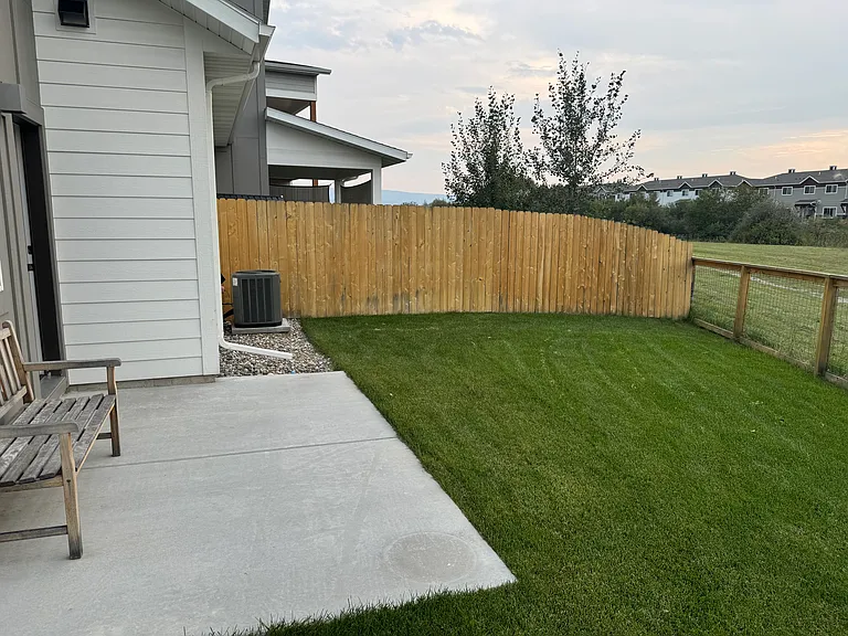 Back yard with the back door on the left