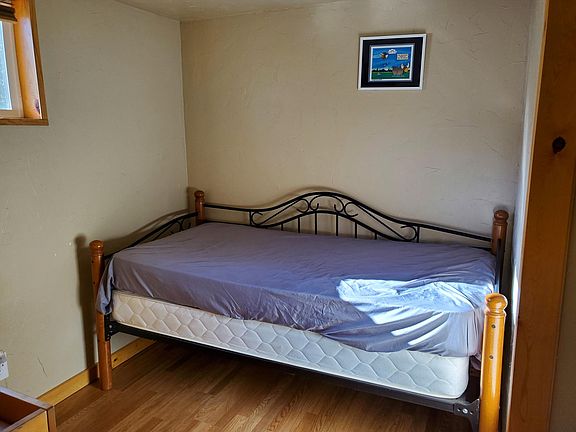 Single bedroom with changing table type dresser.