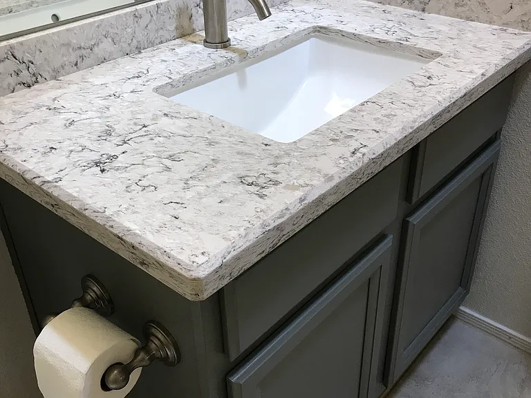 Secondary bedroom bathroom has quartz countertop, upgraded sink and faucet (New shower/tub combo and toilet in July 2026 - pictured will be added when completed).