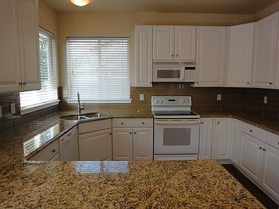 Large open kitchen with lots of storage and upgraded cabinets. A pantry which is large and welcoming to that Costco shopping trip.
