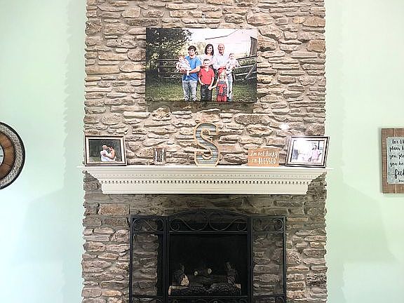 Living room with gas logs.