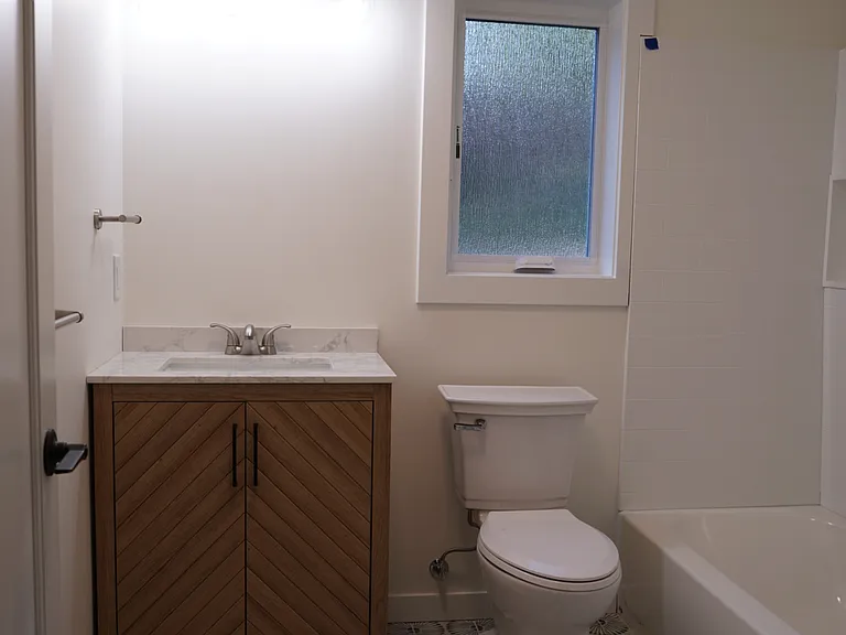 Downstairs full bathroom with tub/shower combo (mirror to be added)