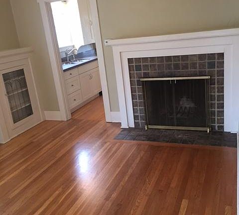 Living room with wood burning fireplace