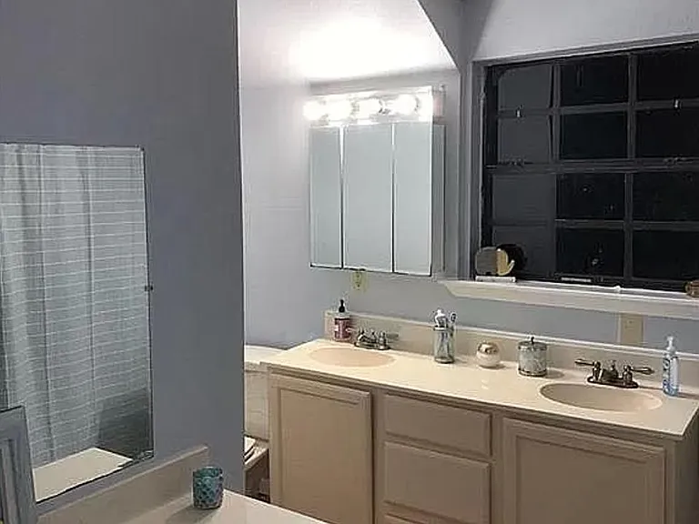 Upstairs full bathroom. 2 sinks, plenty of storage along with an additional cabinet for linens (not shown)
