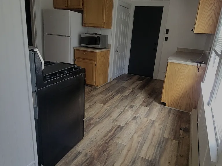 Kitchen view. The door in the photo goes to the back porch.