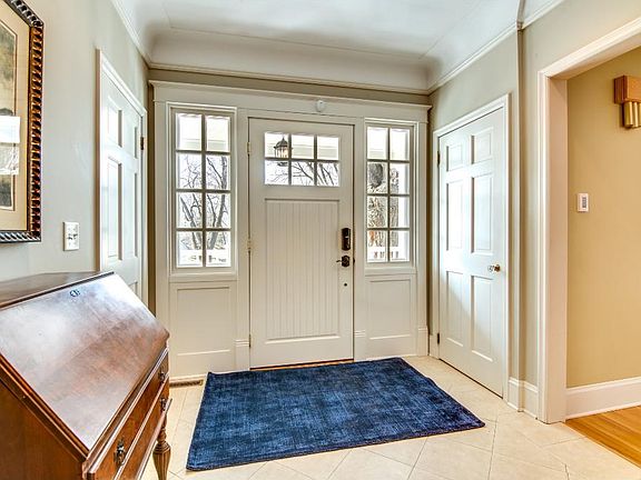 Foyer shows new front door and front porch to gaze upon the pond below
