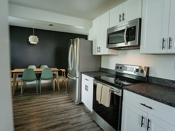 Kitchen with gorgeous stainless steel appliances and an electric oven.