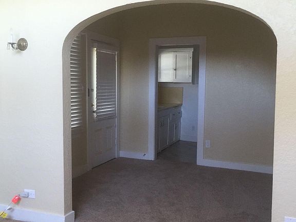 Apt 2 in living room looking through to dining room and kitchen