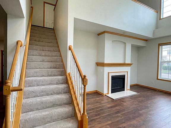 View to loft area & gas fireplace