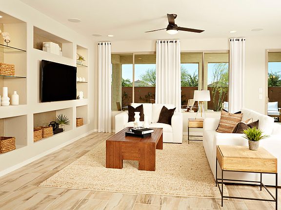 This spacious and bright gathering room features a built-in audio visual center