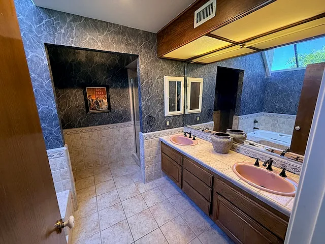 Primary bath features a double vanity