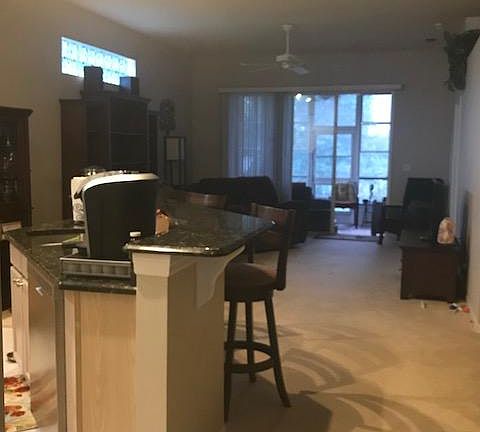 Open Floor plan with kitchen island into the living room