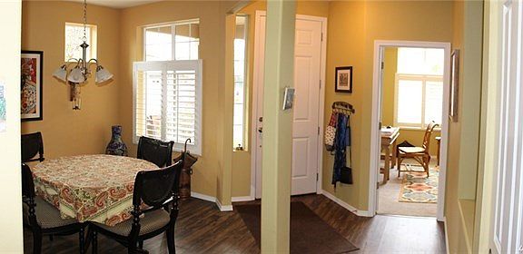 Entry way offers a warm welcome, dining room to the left and office/guest room to the right.